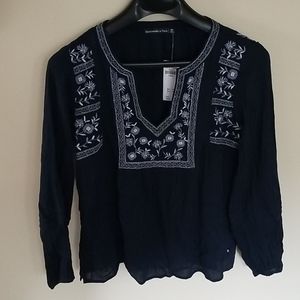 Long sleeve navy blouse with floral stitching